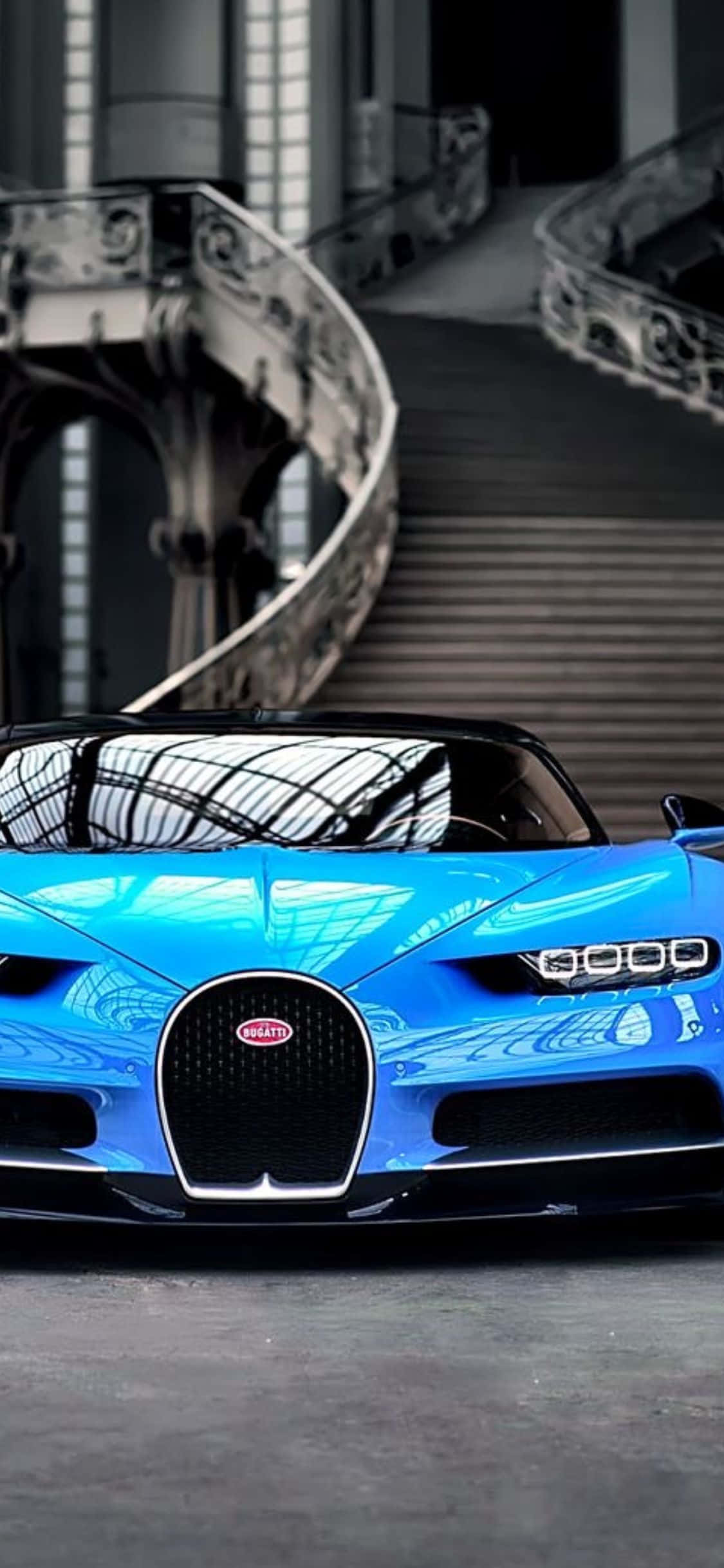 "এই মসৃণ ও পরিশীলিত Bugatti ডিজাইন ব্যাকগ্রাউন্ডের সাথে সর্বশেষ আইফোন XS-এর মালিক হোন।" ওয়ালপেপার