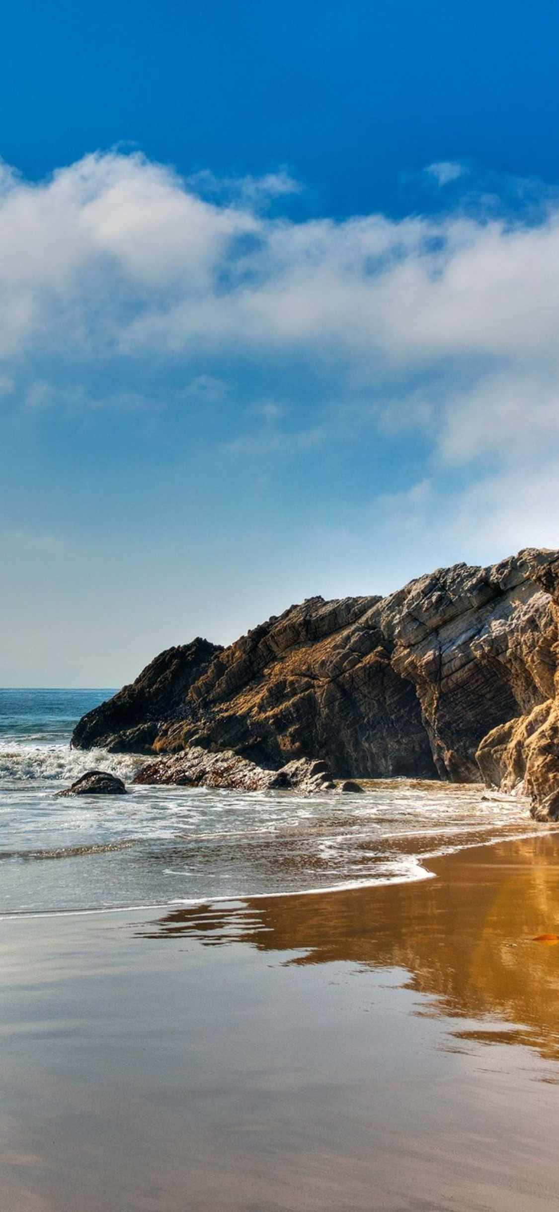 আপনার iPhone Xs Malibu দিয়ে একটি সুন্দর সমুদ্র দৃশ্য উপভোগ করুন ওয়ালপেপার