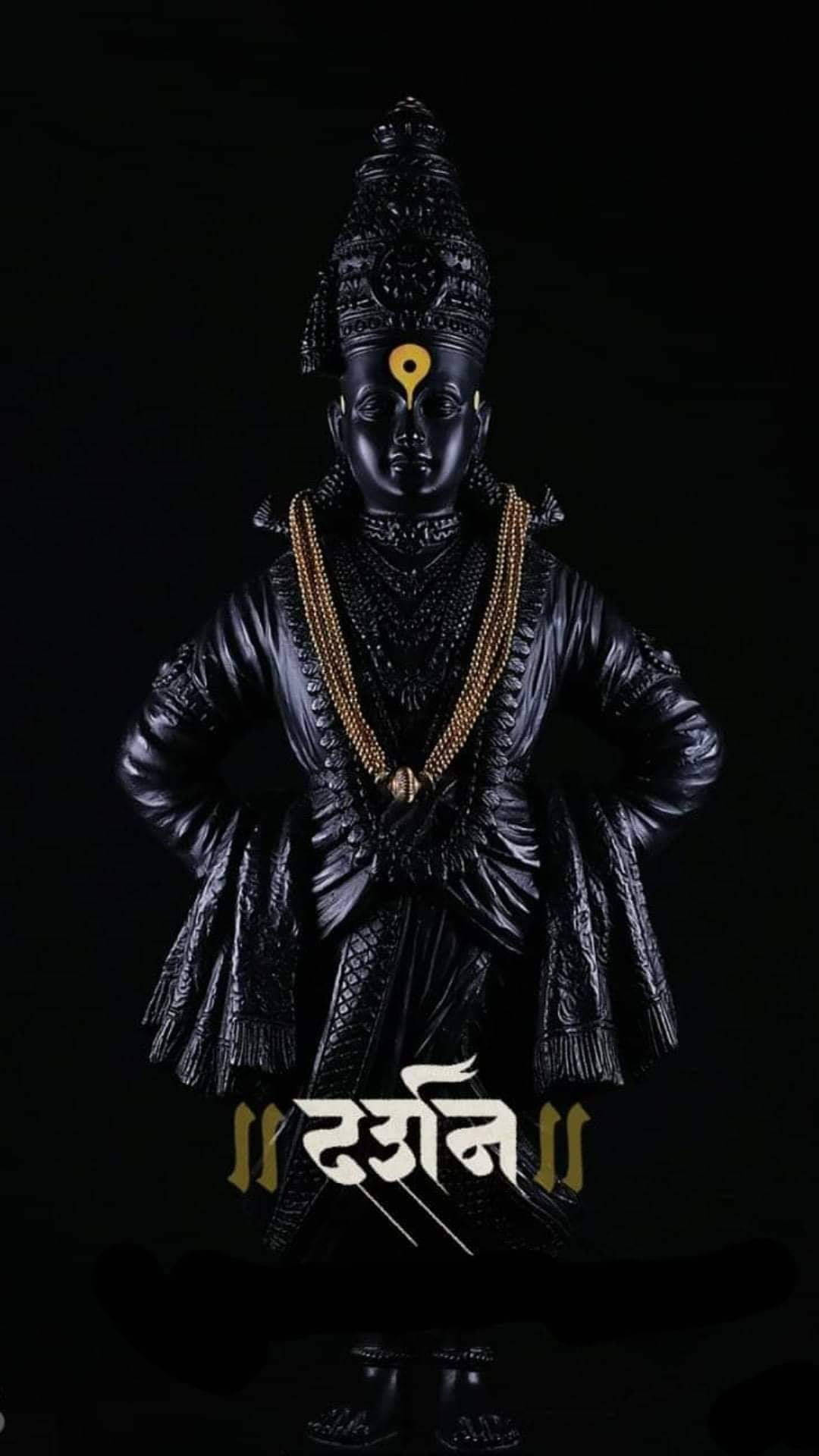 কাঠের খোদাই করা বিঠল মূর্তি