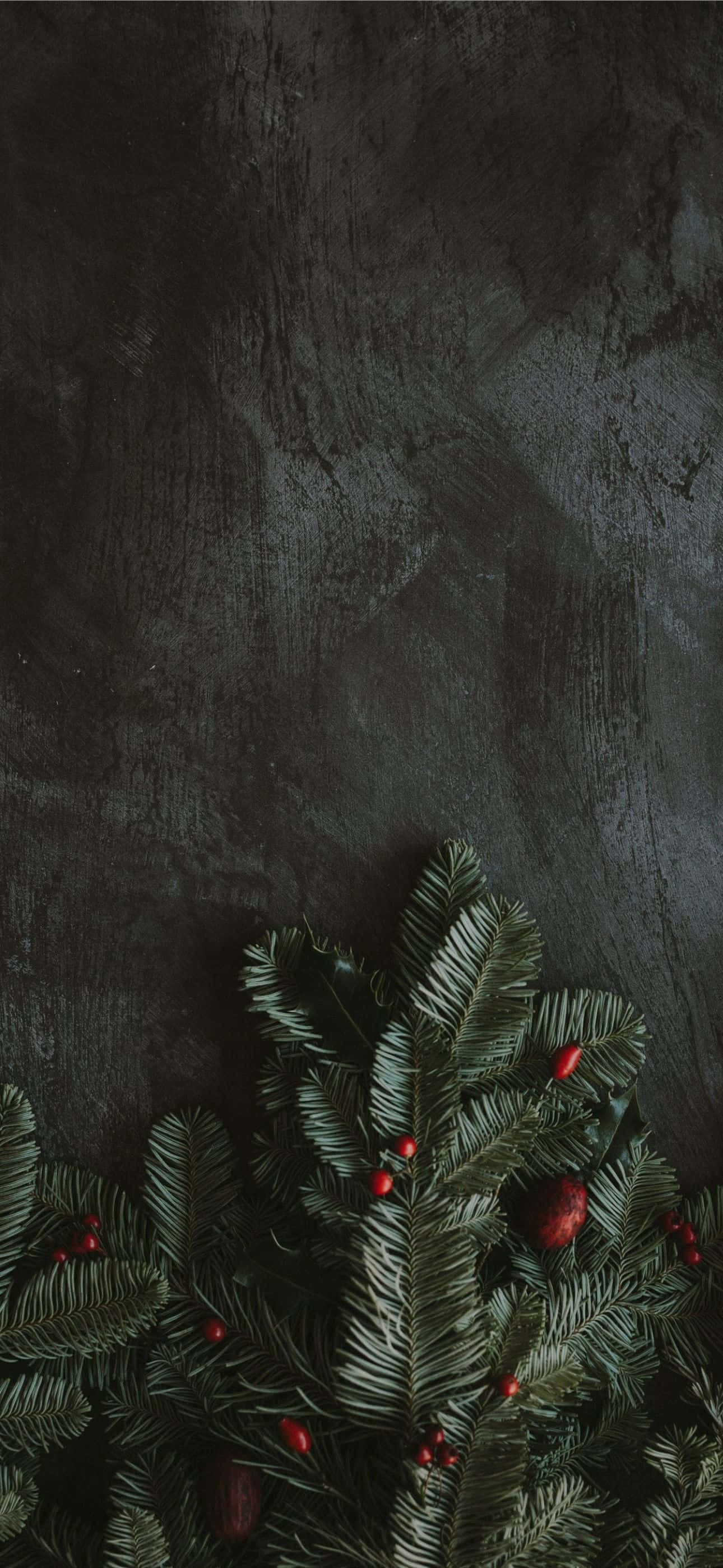 গোল্ডেন iPhone-এর উপর লাল ক্রিসমাস অলঙ্কার ওয়ালপেপার