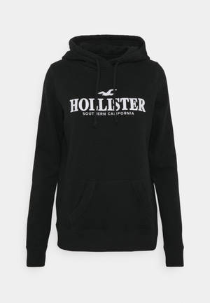 Hollister মিনিমালিস্ট কালো হুডি জ্যাকেট ওয়ালপেপার — পরিষ্কার ওয়ালপেপার