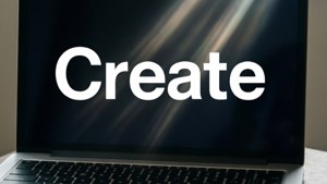 একটি ন্যূনতম ম্যাকবুক ওয়ালপেপার যেখানে 'Create' শব্দটি গাঢ় অক্ষরে লেখা।